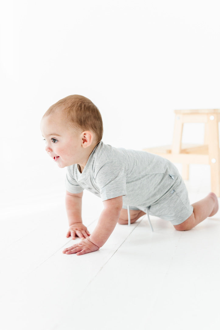 Baby crawling in the Onesie Tee