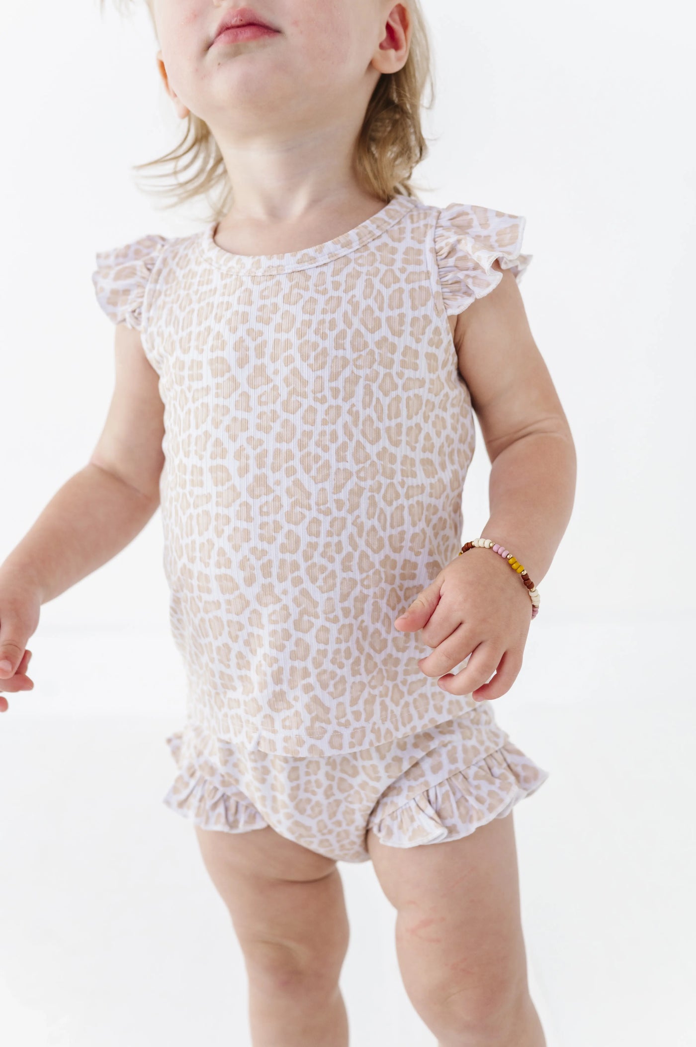 Close up of the Onesie Tee fabric and snaps