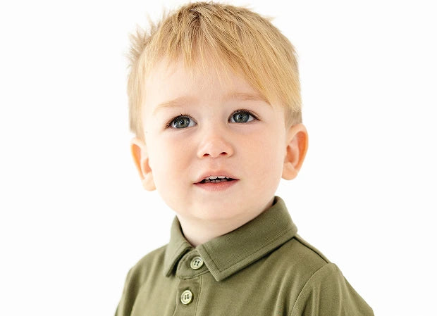 Child wearing an olive polo