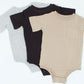 Three baby bodysuits in black, gray, and beige on a white background