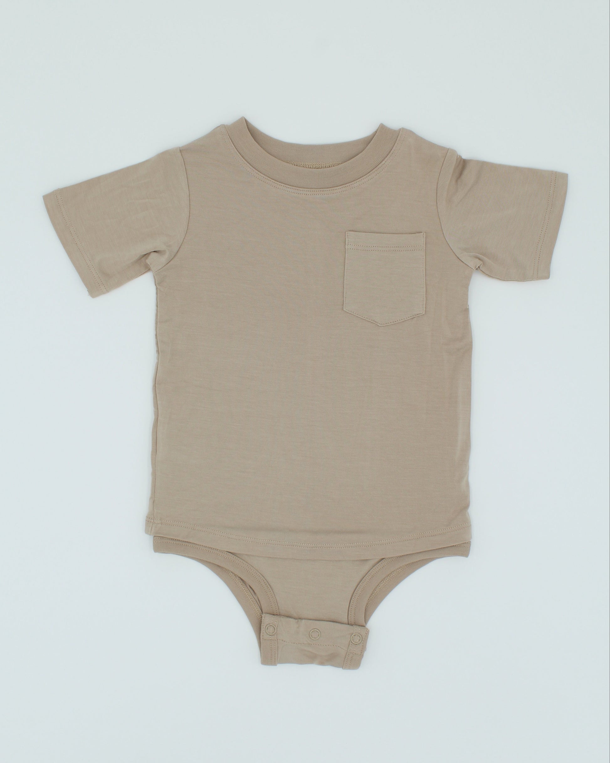 Beige baby onesie on a light gray background